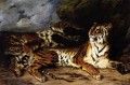 Un tigre joven jugando con su madre
